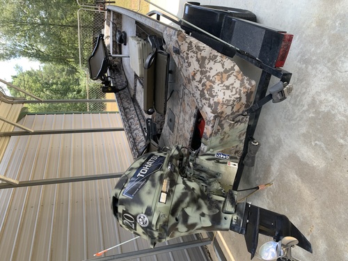 Duck hunters and fishermen! 15 1/2 foot camo Excel boat with 20 hp Tohatsu outboard and trailer. 