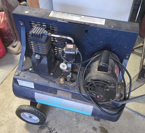 Air Compressor.     Belt drive.  100 psi 