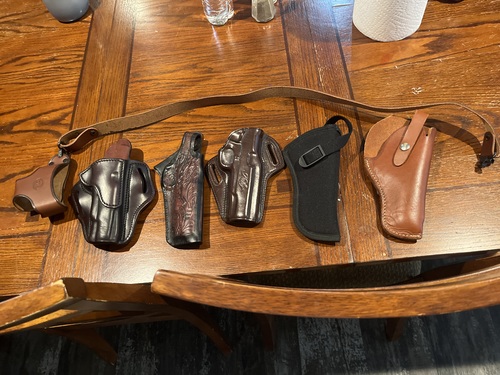 Holsters and a rifle sling 