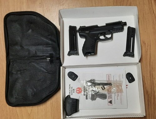 Ruger SR 22 with 2 mags, threaded adapter.